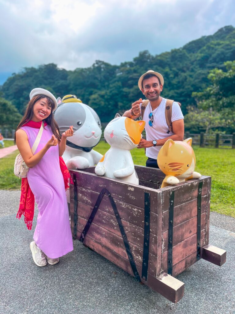 A couple at HuoTong Cat Village, the best day trip from Taipei