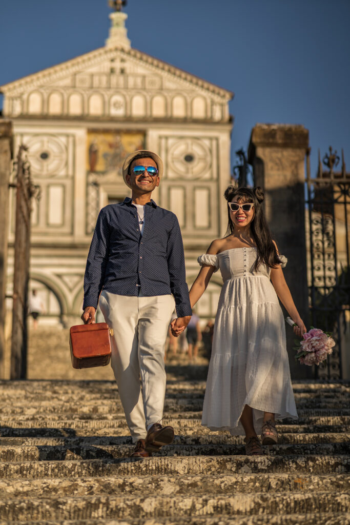 A couple near Uffizi Gallery museum wearing a dressy couple that matches Uffizi Museum dress code. Uffizi Gallery is in Florence Italy.