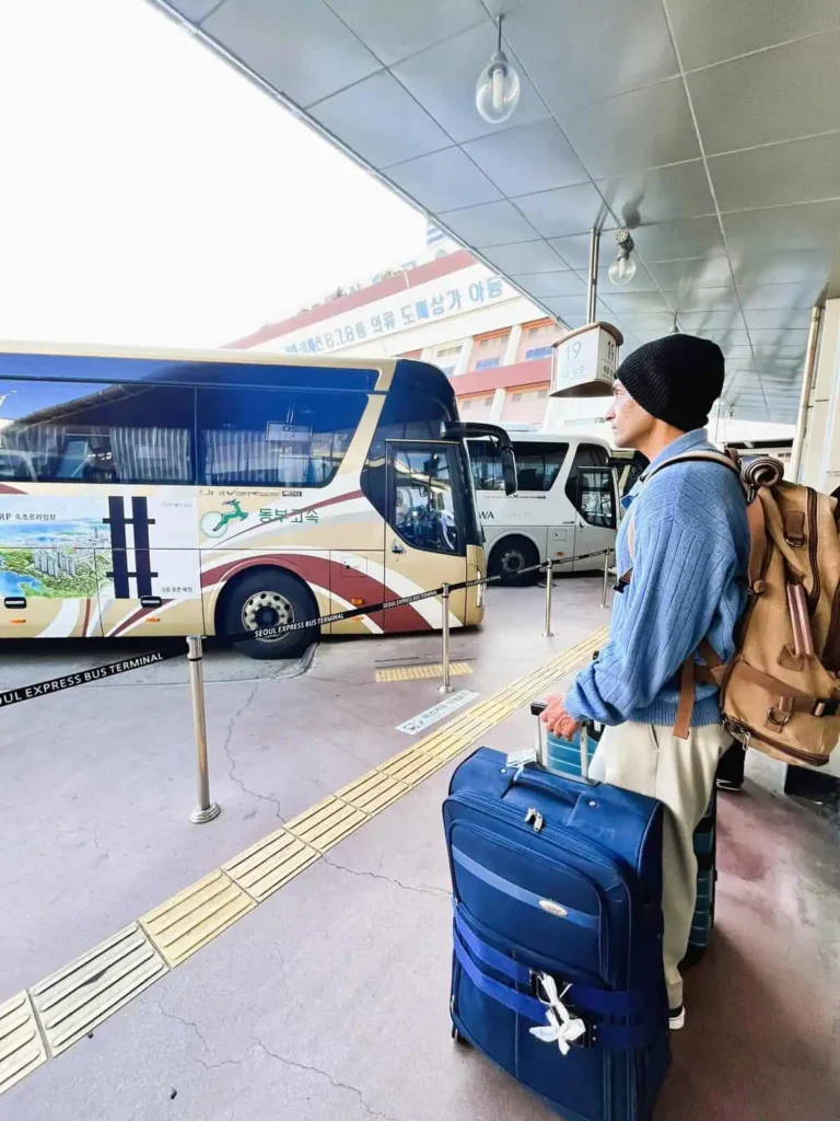 Deeshen with luggage waiting to board the Seoul to Sokcho bus which takes us to Seoraksan National Park