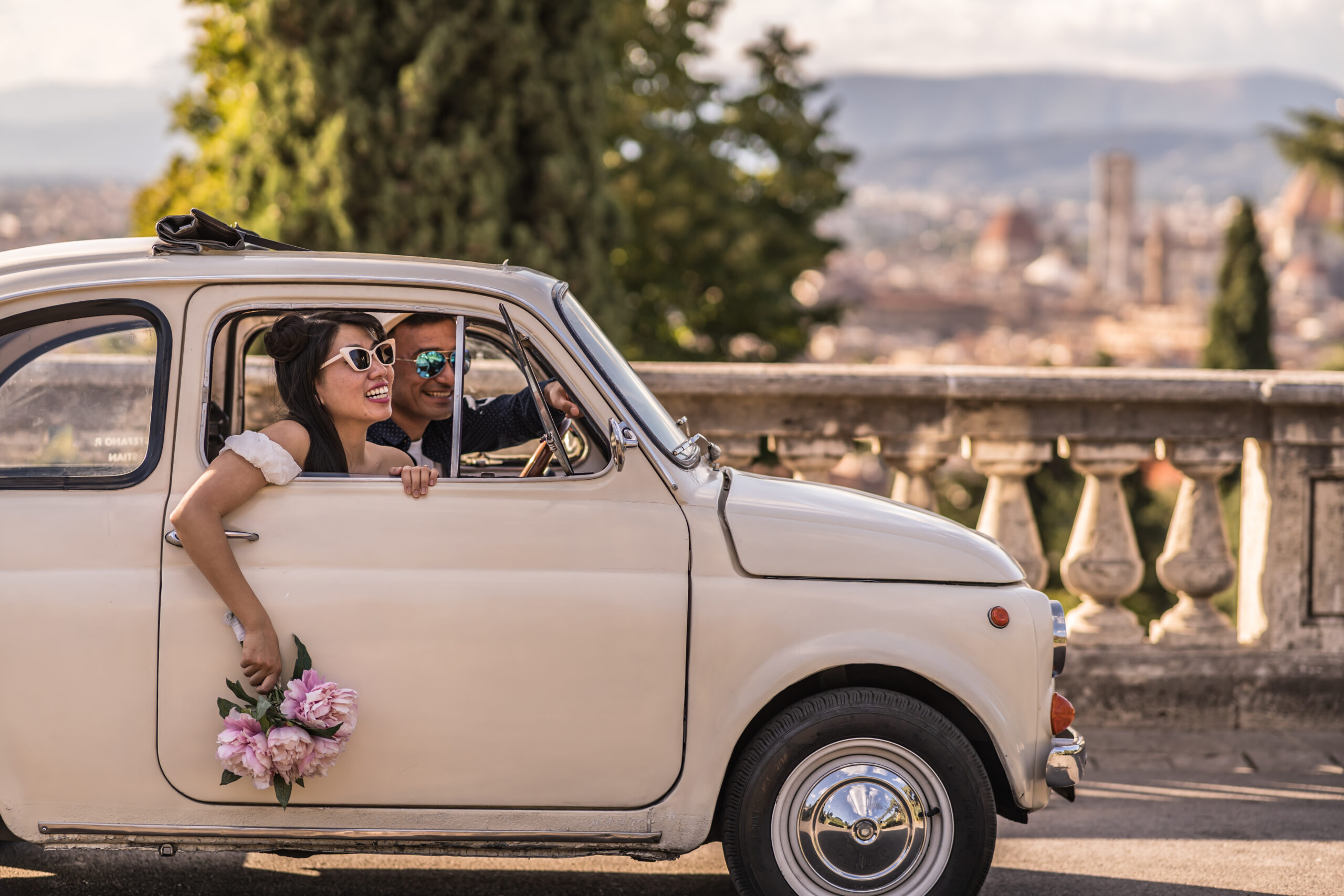 couple in a vintage car in florence, italy