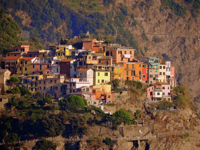 Stunning view of Corniglia, a picturesque village perched atop cliffs along the coast of Cinque Terre, Italy.